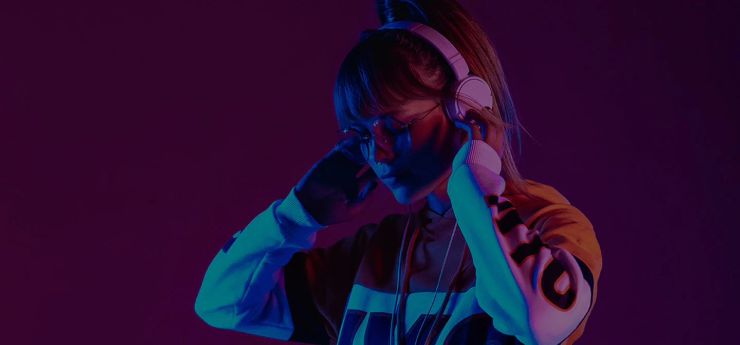 Person enjoying music in colorful lighting